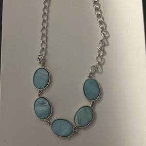 This is a beautiful teal/ sliver necklace. Barely worn, needs a new home.